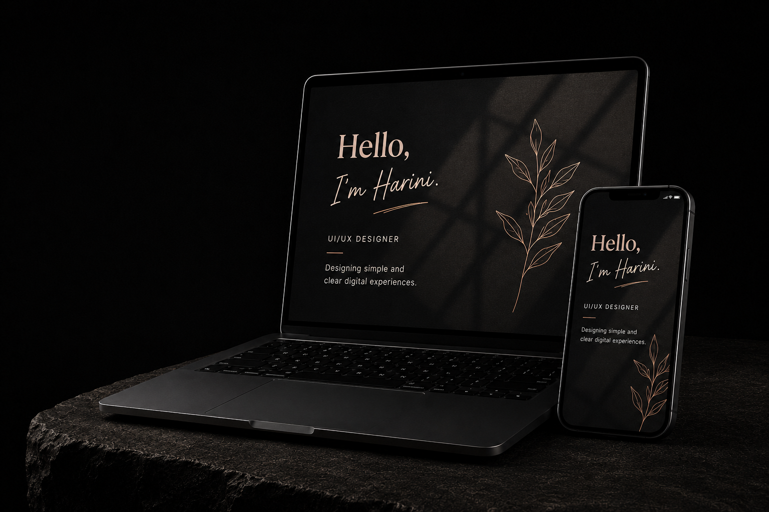 Laptop and phone displaying Harini's portfolio